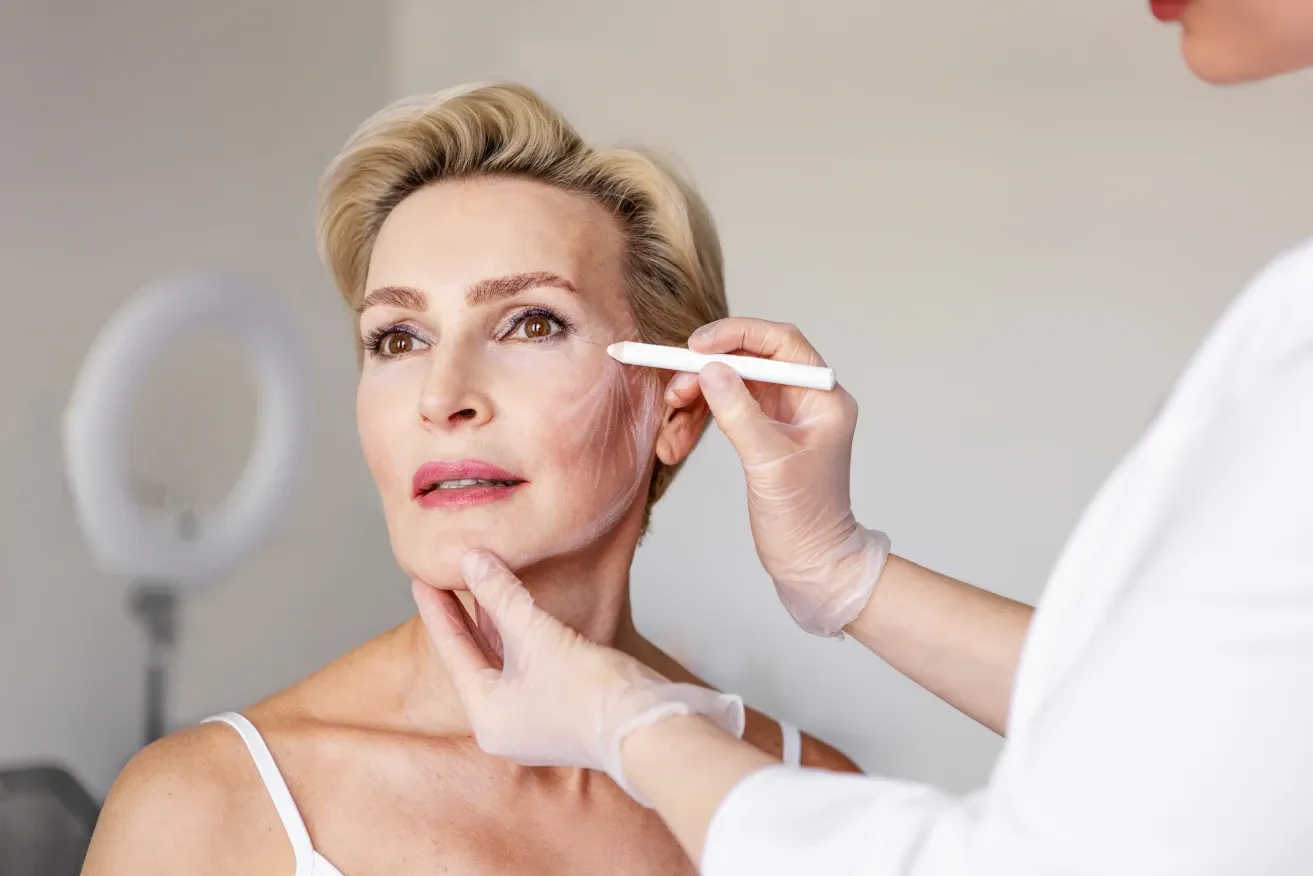 Patient attending a routine follow-up appointment with her plastic surgeon