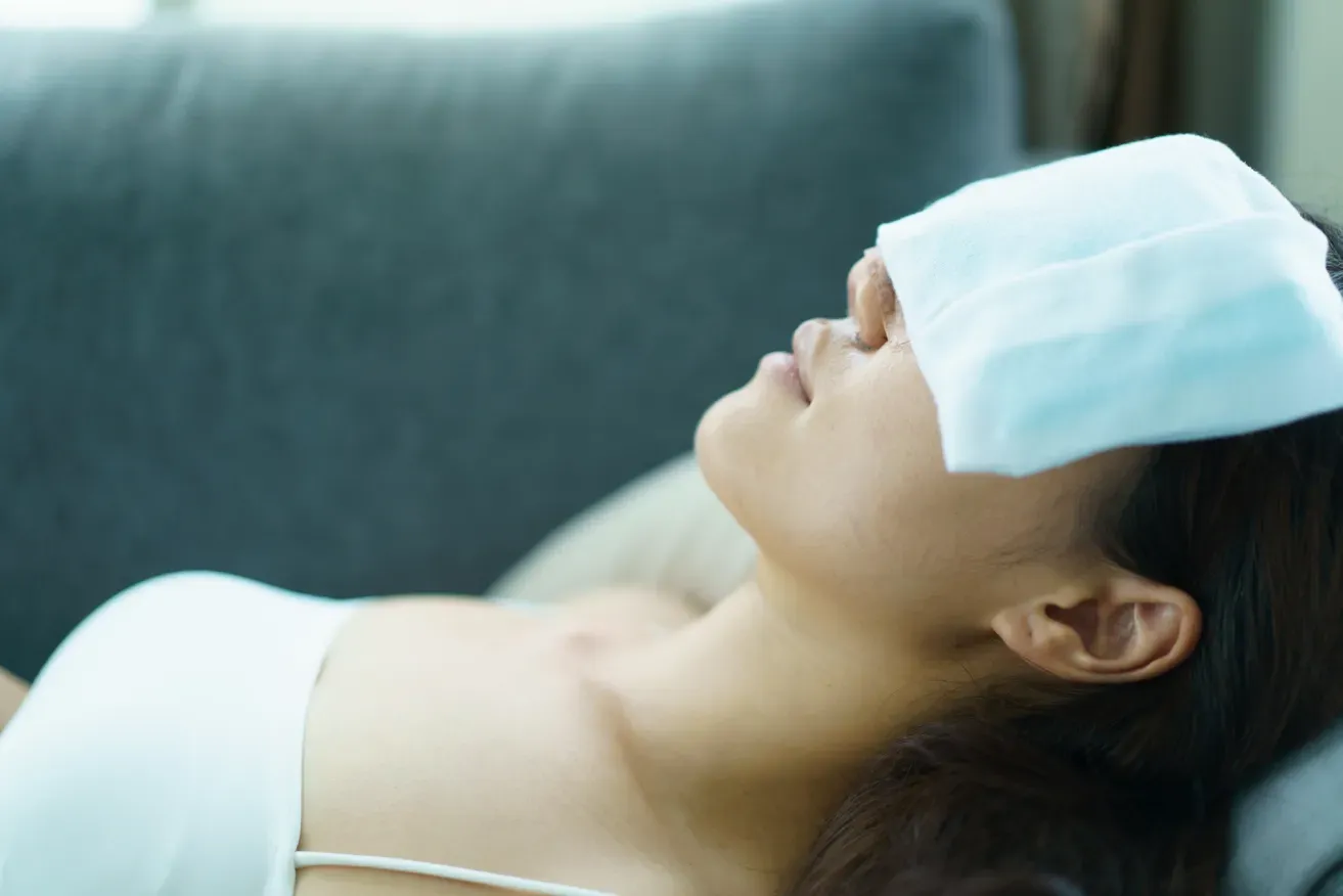Woman with her eyes bandaged post-operation