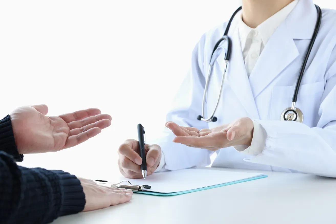 Plastic surgeon and patient during a double eyelid surgery consultation